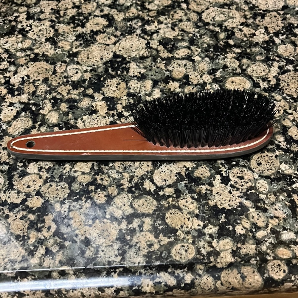 Leather handle brush with moderately soft bristles